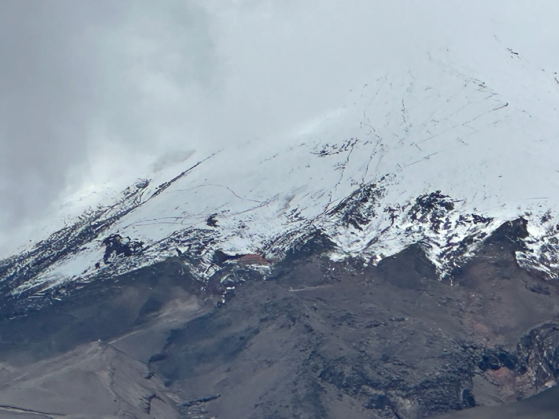 Close-up of the crevassed summit glacier above Cotopaxi’s rock bands